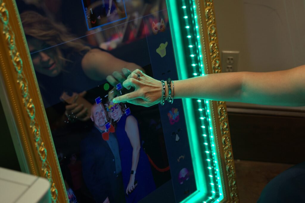 girl making picture on a wedding even with photobooth