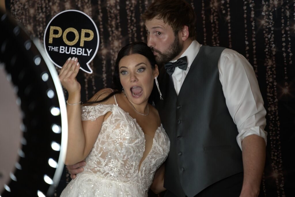 couple at a wedding event orama photobooth