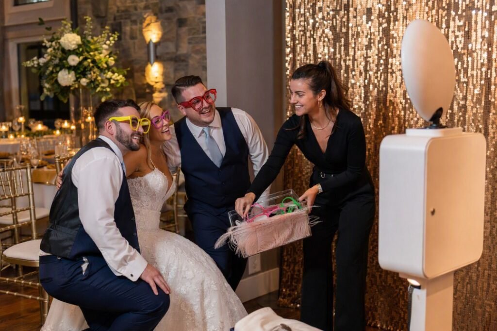 Photo booth attendant assisting guests at a Lancaster PA wedding reception
